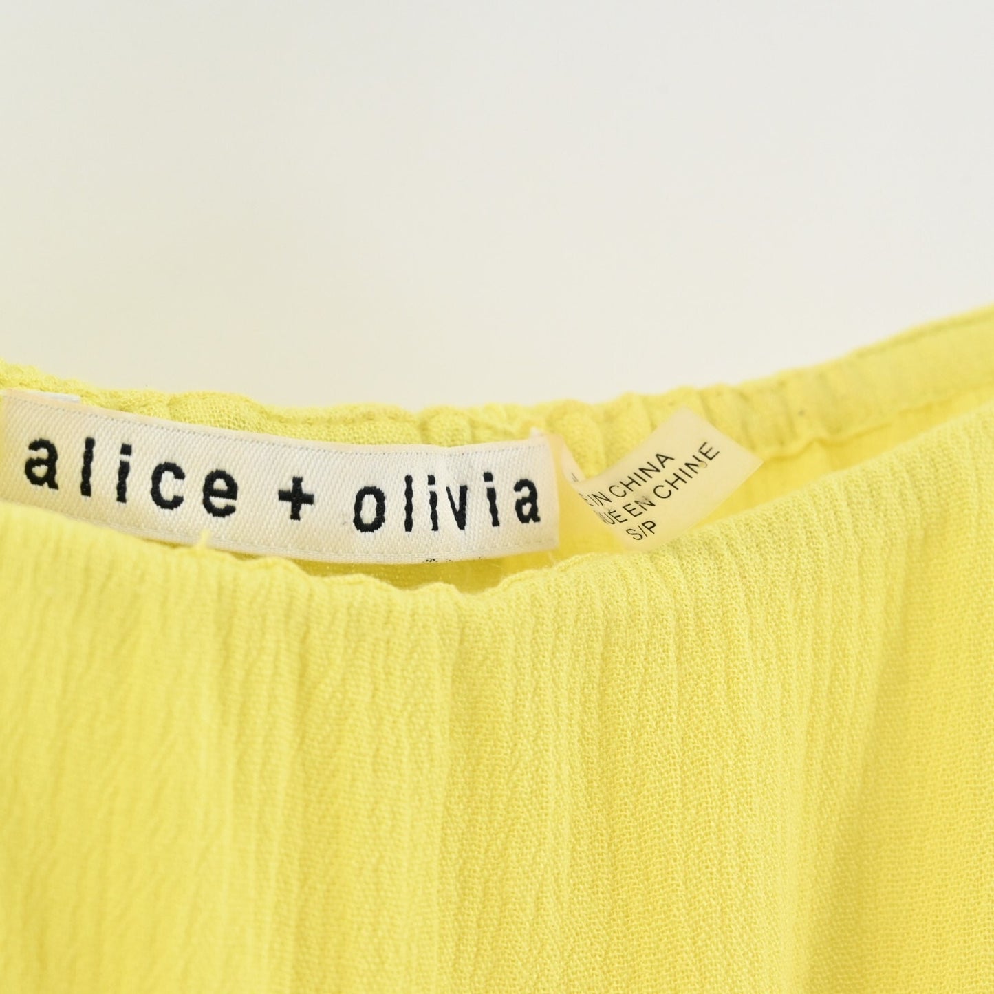 ALICE OLIVIA Womens Meagan Top Size S Yellow Cold Shoulder Pom Pom Trim Blouse