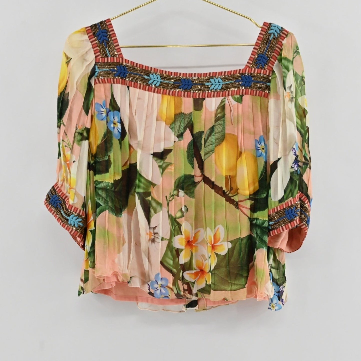 Lynn's Closet Boutique Anthropologie Verb pleated top with floral print, square neckline, and beaded embroidery.