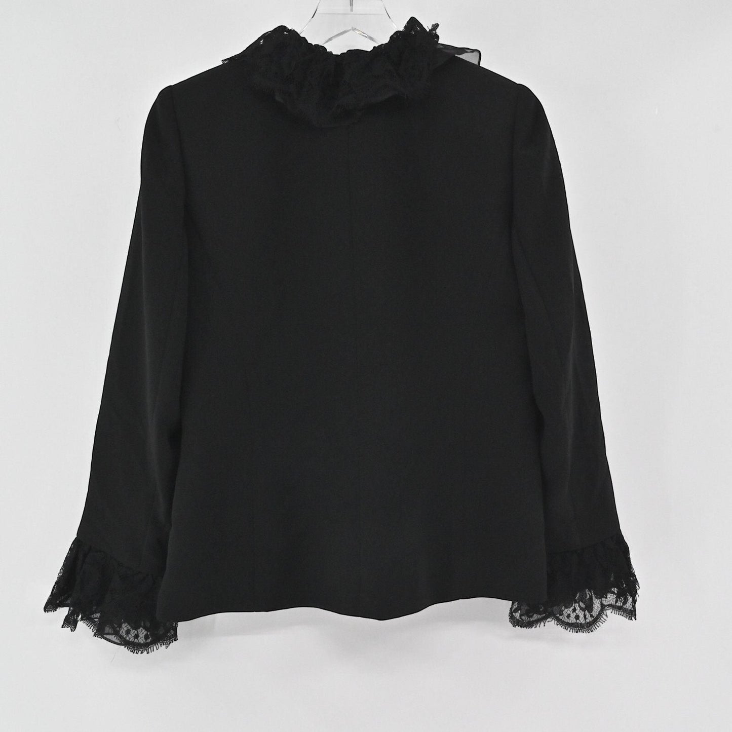 Lynn's Closet Boutique black Nina Raynor jacket featuring a ruffled lace collar and lace-trimmed cuffs, back view.