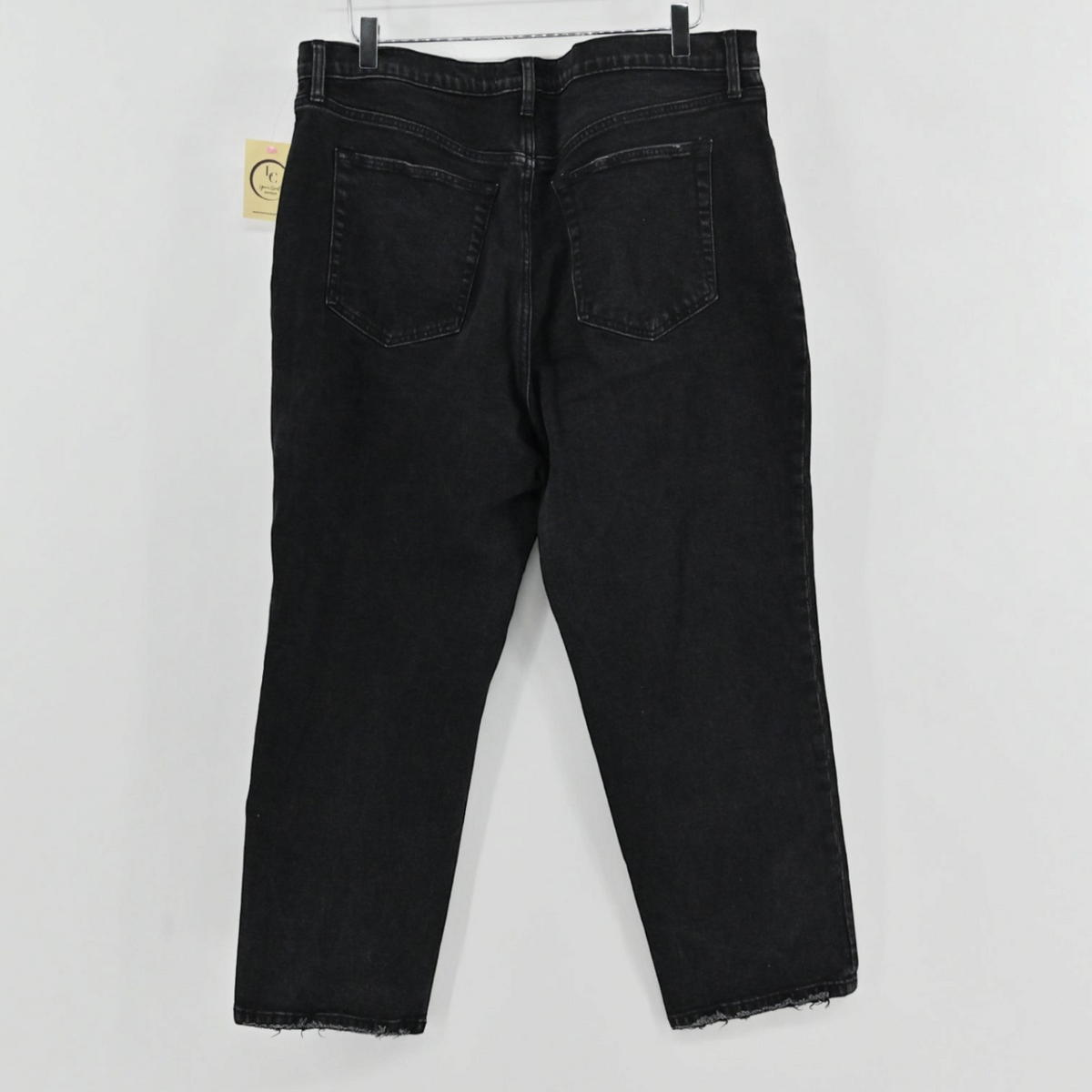 Lynn's Closet Boutique Abercrombie & Fitch black denim ankle straight jeans with a distressed hem, back view.