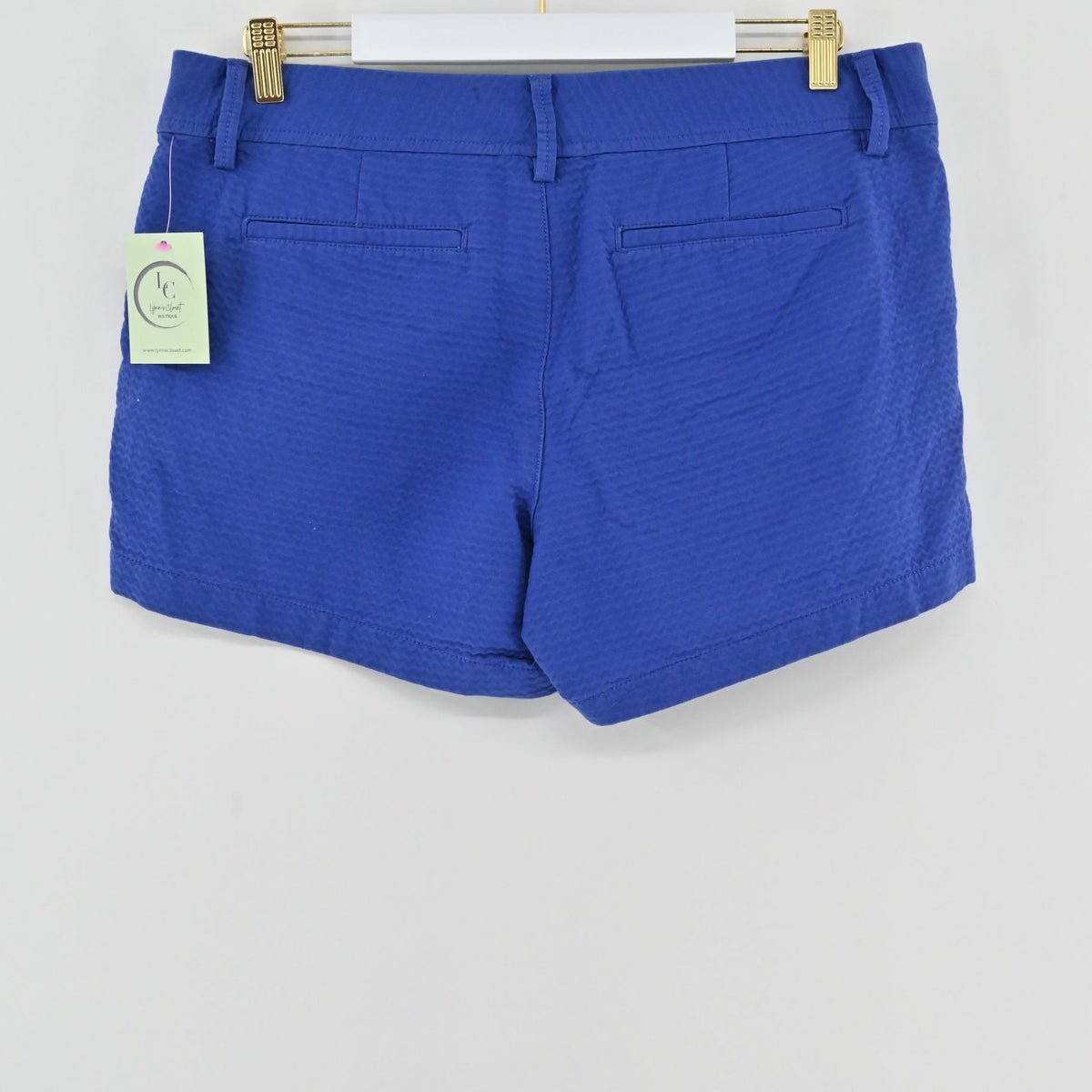 Back view of Lynn's Closet Boutique Lilly Pulitzer Callahan blue wavy textured shorts with back pockets and belt loops