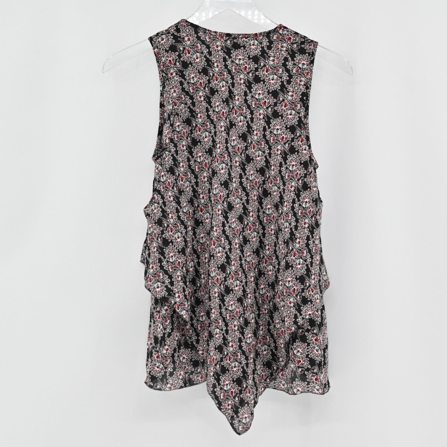 Lynn's Closet Boutique sleeveless silk top with a black and multi-colored floral print and tiered ruffle details.