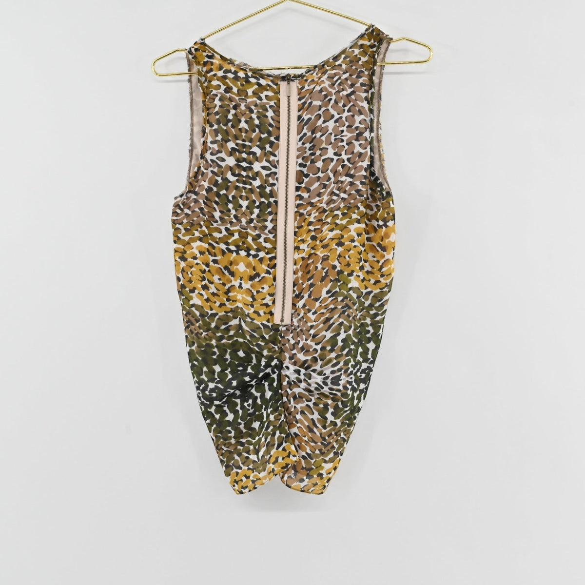Lynn's Closet Boutique Magaschoni sleeveless top with olive, mustard, and brown animal print and back zipper detail.