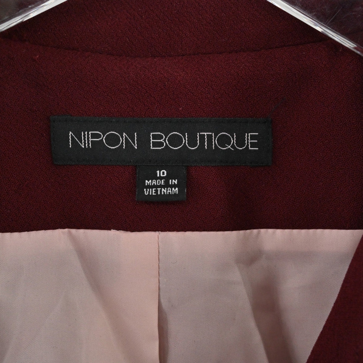 Lynn's Closet Boutique Nipon Boutique maroon blazer interior label showing size 10 and made in Vietnam tag