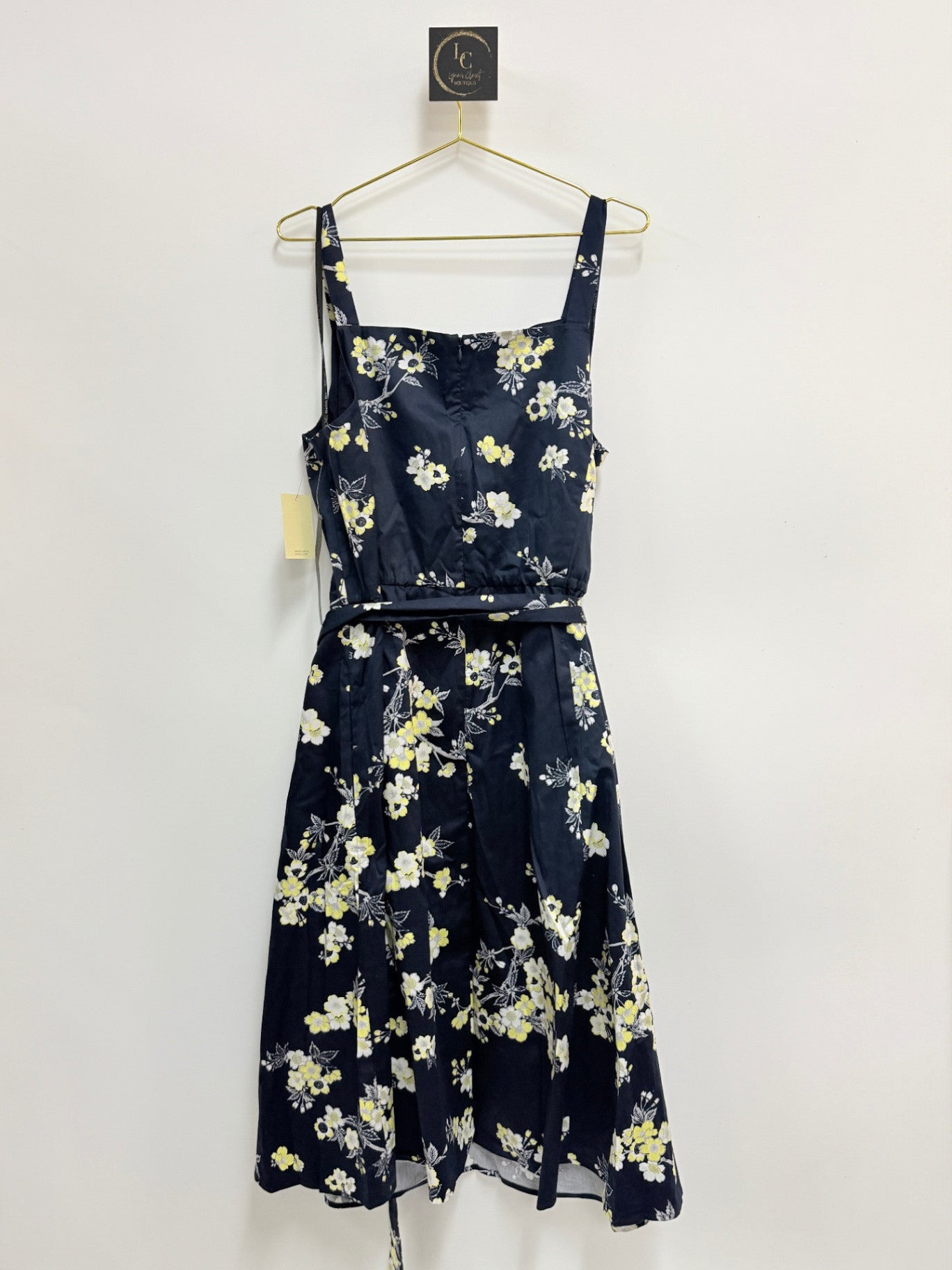 Lynn's Closet Boutique Rachel Roy navy floral dress with square neckline, adjustable straps, and matching waist belt.