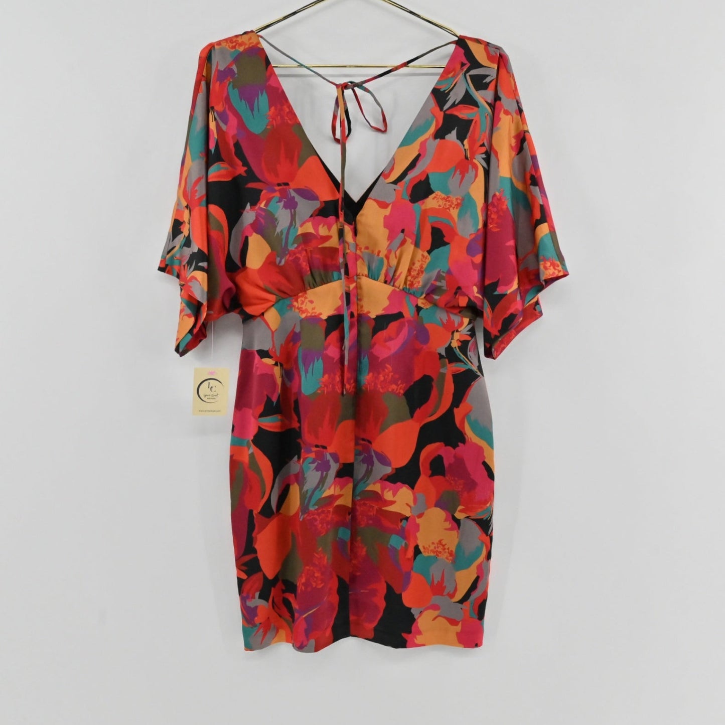 Lynn's Closet Boutique Aidan Mattox satin mini dress with vibrant floral print, V-neck, and kimono sleeves.
