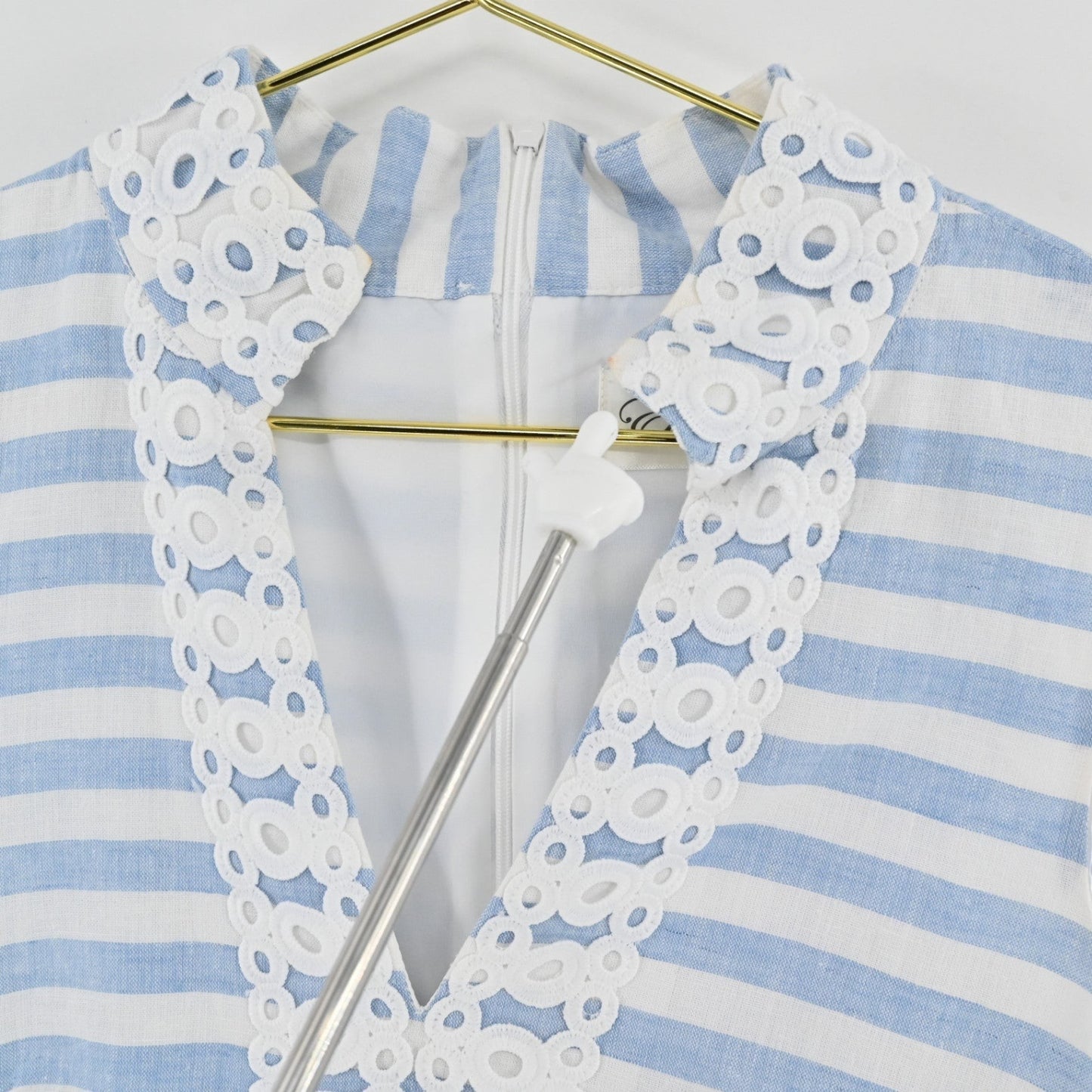 Lynn's Closet Boutique Eliza J blue and white striped shift dress with white eyelet lace trim on the notched neckline