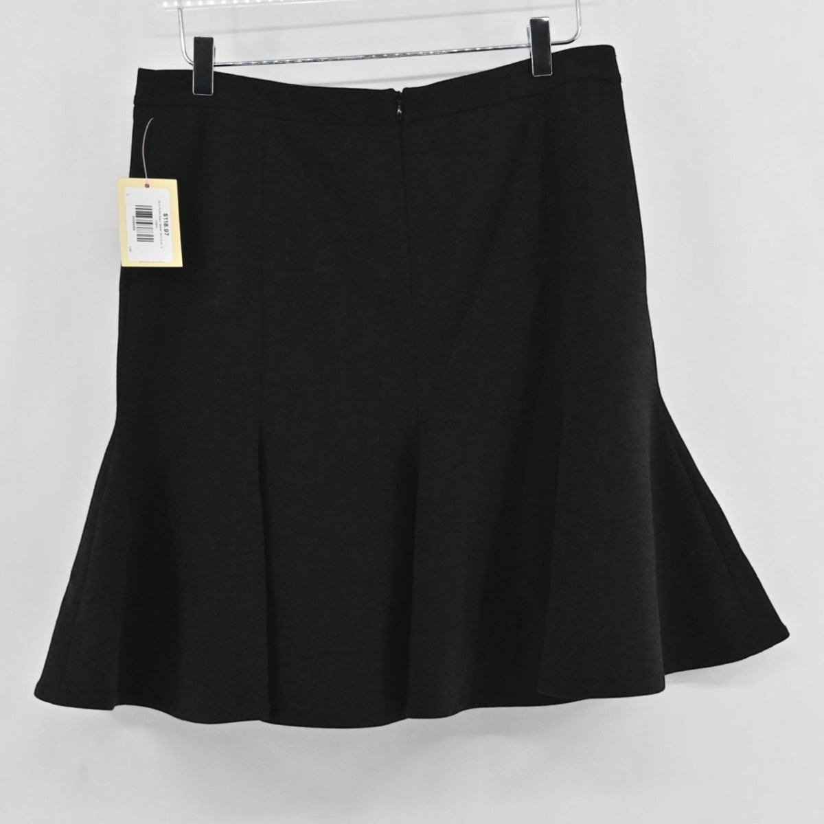Lynn's Closet Boutique Akris Punto black skater skirt with a flared godet hemline hanging on a hanger