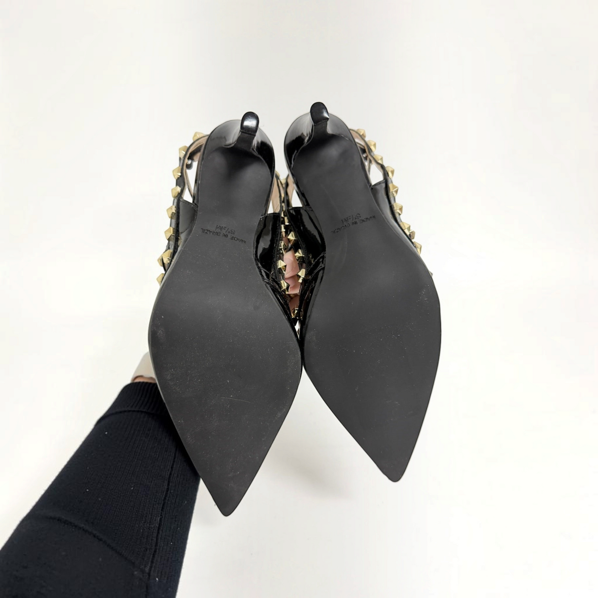 Lynn's Closet Boutique FS/NY black patent studded heels showing the pointed-toe soles and gold pyramid stud details