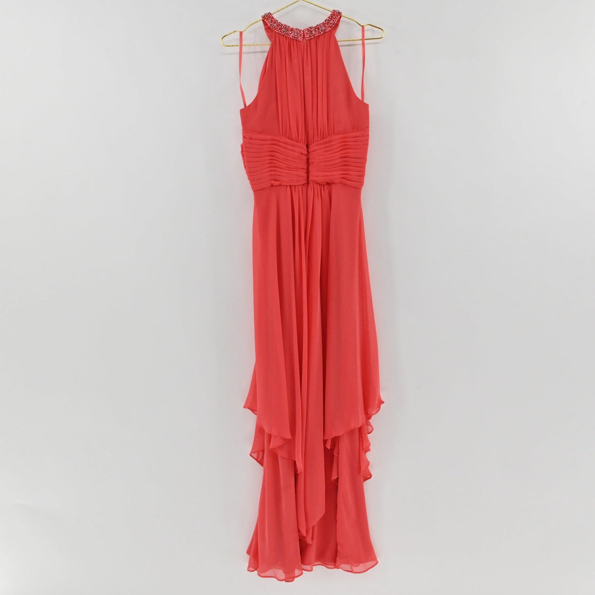Lynn's Closet Boutique coral chiffon high-low halter dress with an embellished neckline and ruched bodice