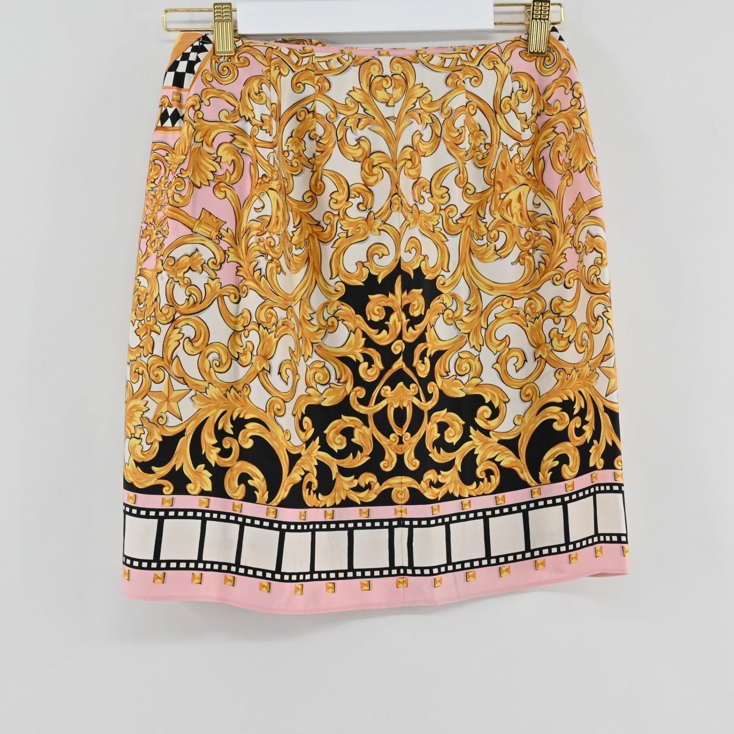 Lynn's Closet Boutique vintage Emanuel Ungaro skirt with pink, gold, and black baroque print and film-strip hem.