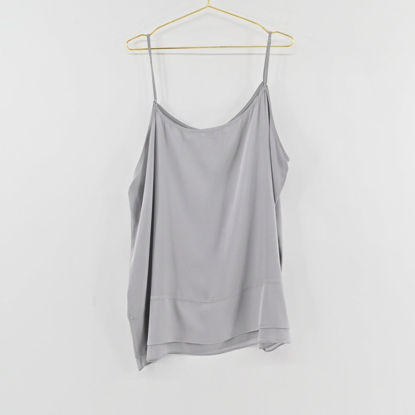 Lynn's Closet Boutique gray silk-blend camisole with adjustable spaghetti straps and a layered hem detail.