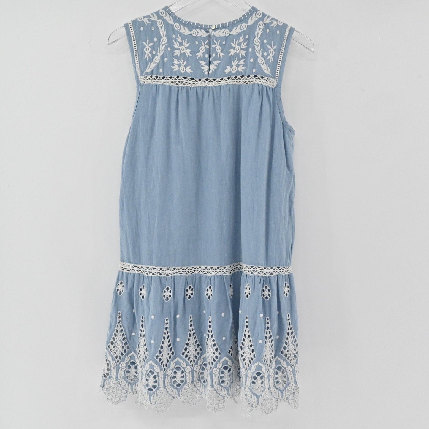 Lynn's Closet Boutique dusty blue Joie mini dress with white floral embroidery, ladder-stitch trim, and eyelet lace hem.