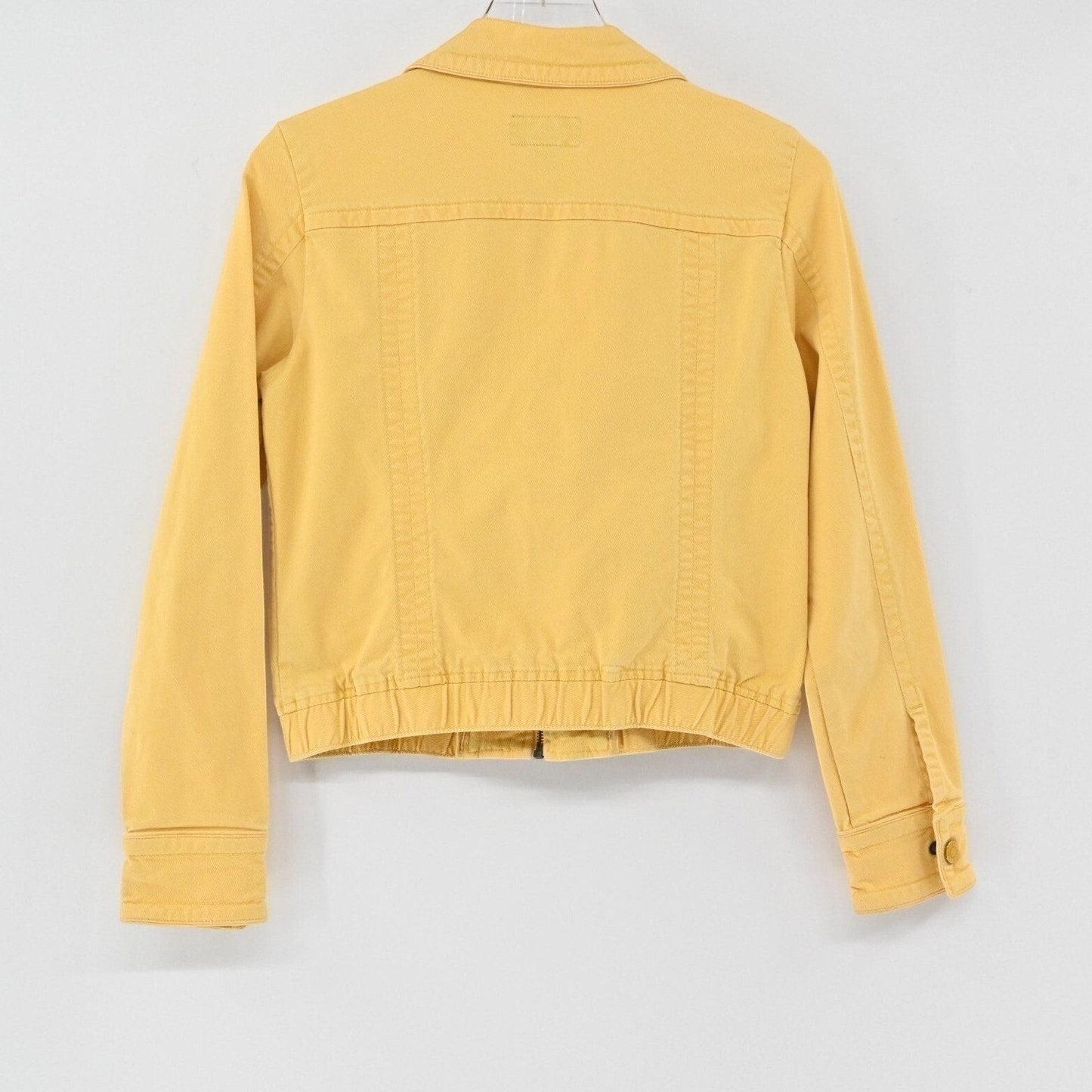 Lynn's Closet Boutique mustard yellow American Eagle zip-up trucker jacket, back view showing ribbed hem and collar.