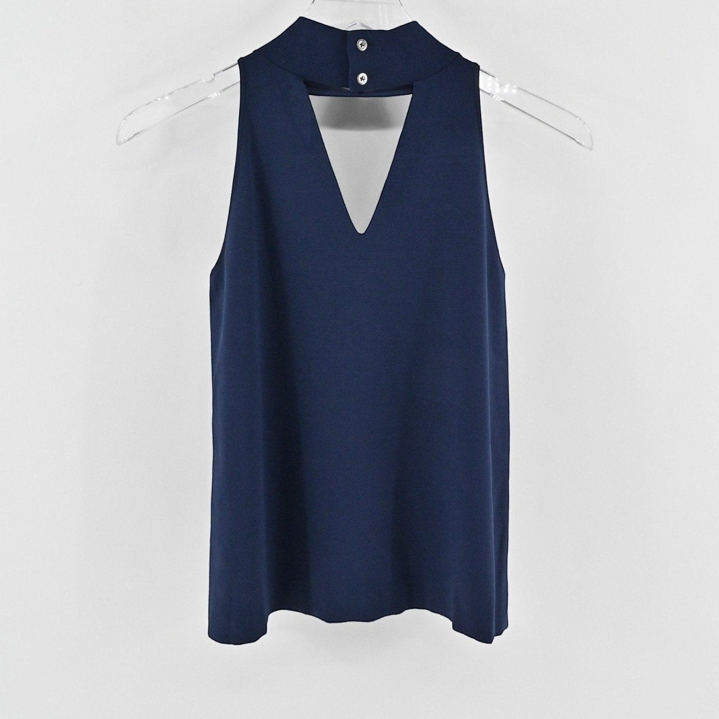 Lynn's Closet Boutique navy sleeveless knit top with a high neck, cutout chest detail, and back button closure.