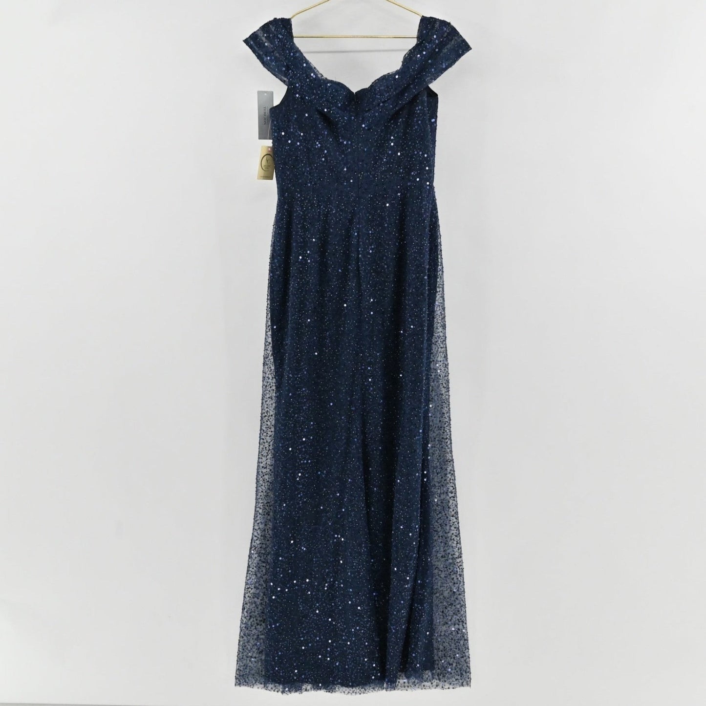 Lynn's Closet Boutique navy sequin floor-length gown with an off-the-shoulder neckline on a hanger.