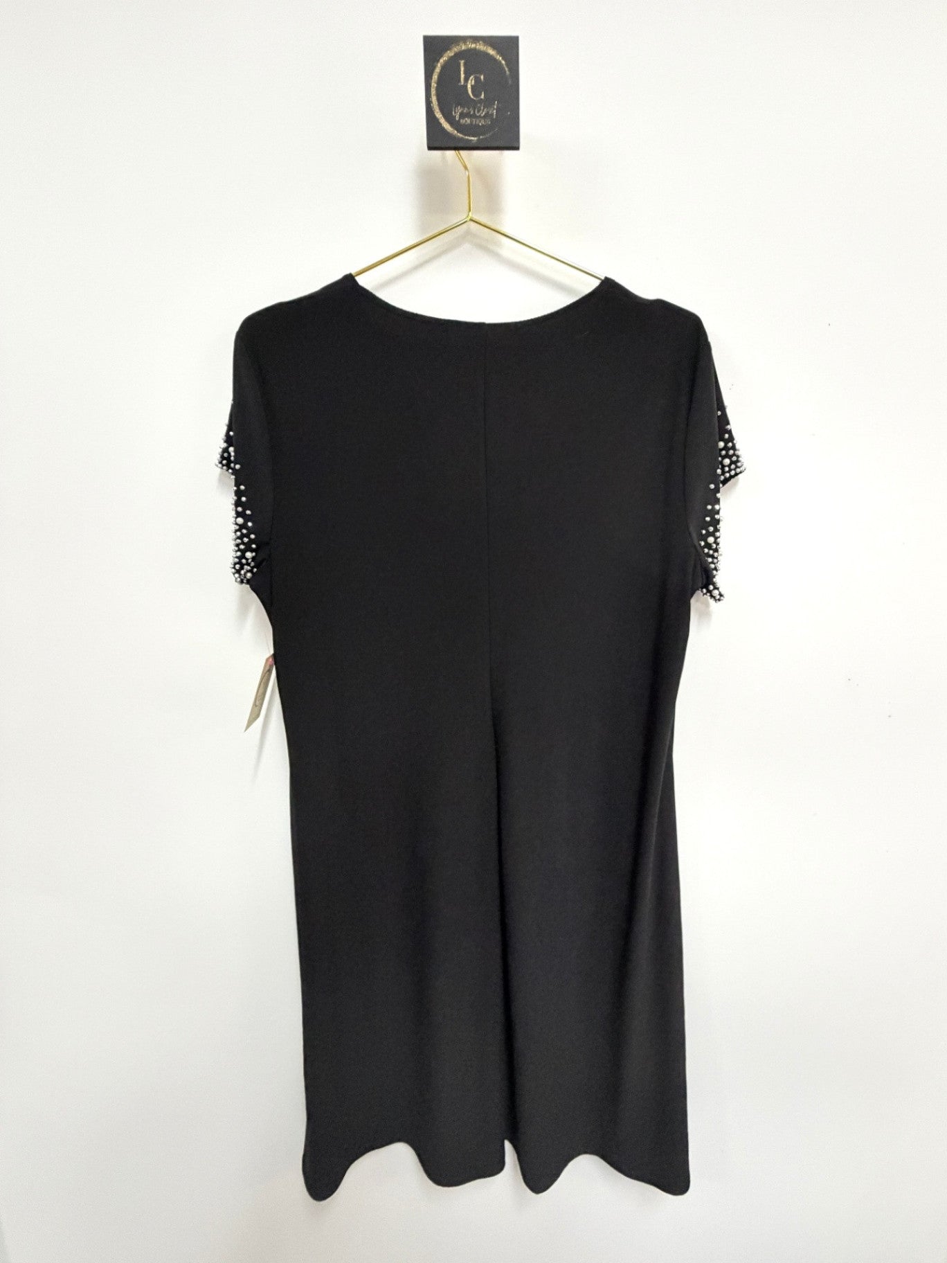 Lynn's Closet Boutique Nik & Nash black midi dress with delicate stud and bead detailing on short sleeves.