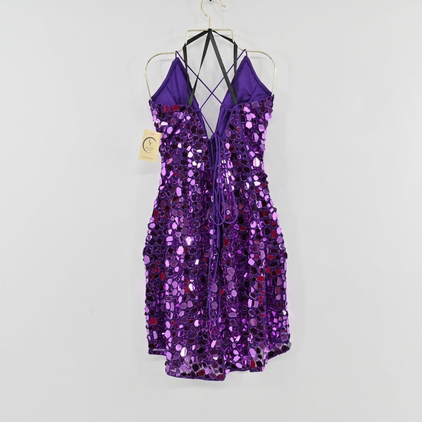 Lynn's Closet Boutique purple mini dress with reflective mirror sequins, spaghetti straps, and lace-up back detail.