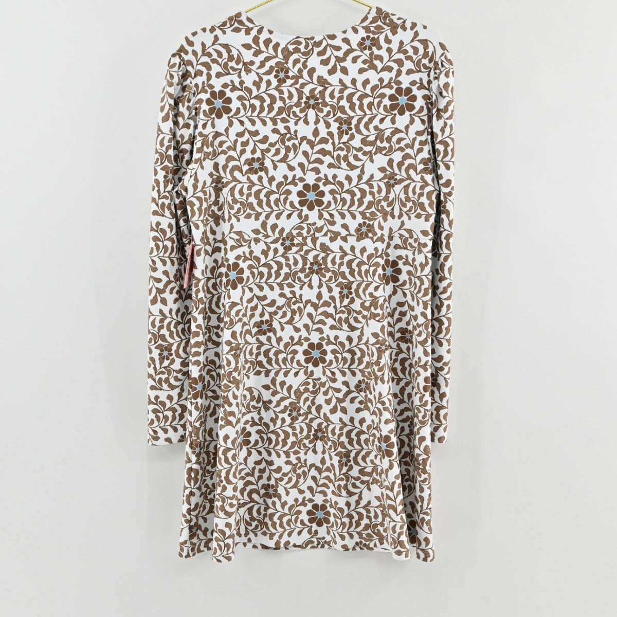 Lynn's Closet Boutique Smith Quinn white dress with brown botanical floral print and long sleeves, hanging view.