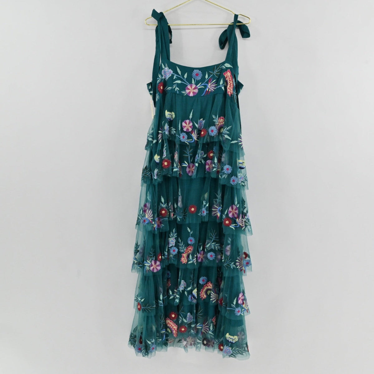 Lynn's Closet Boutique La Fuori teal tiered tulle maxi dress with colorful floral embroidery and tie-shoulder straps.