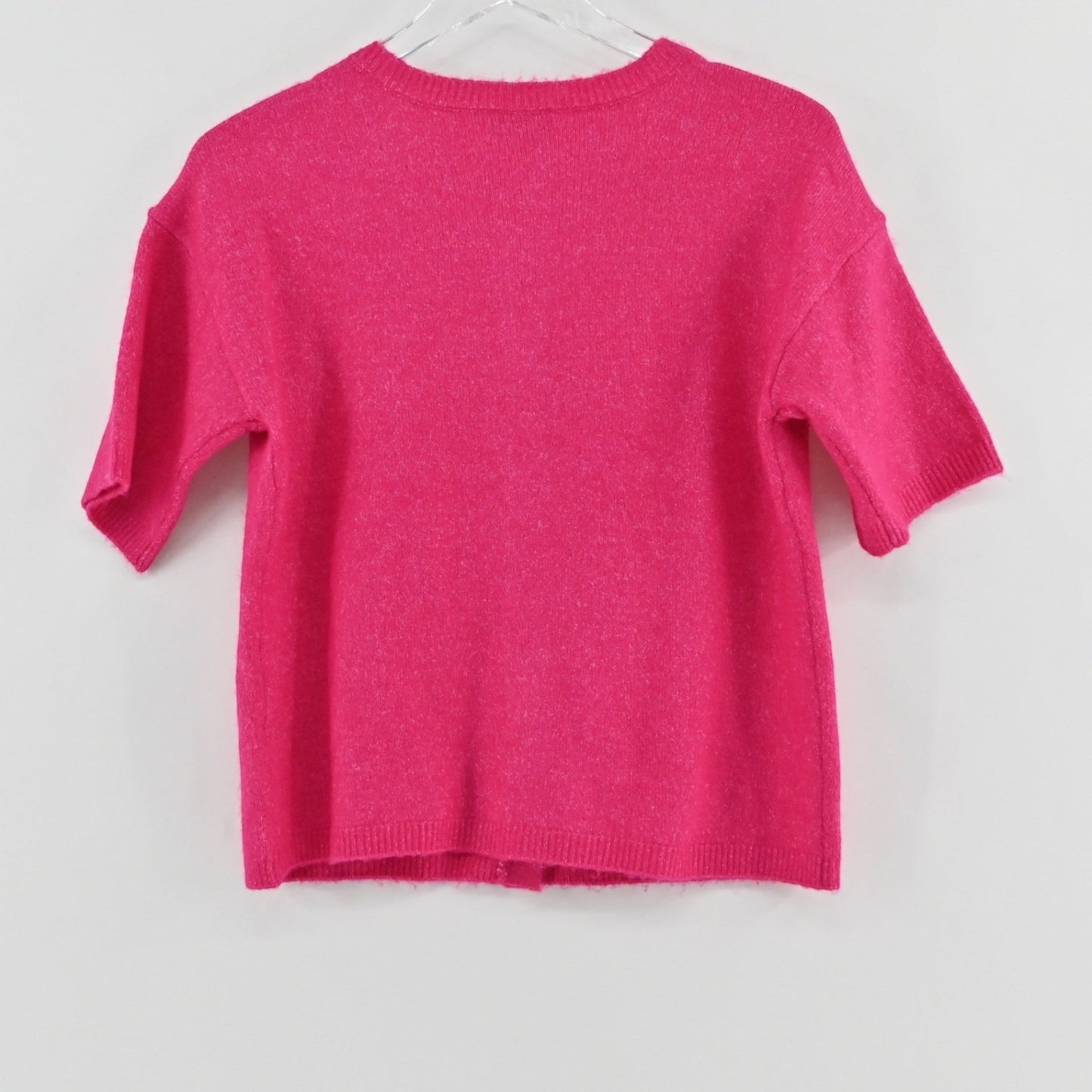 Lynn's Closet Boutique hot pink Vince Camuto short sleeve knit cardigan with a crew neckline, back view.