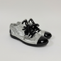 Lynn's Closet Boutique metallic silver lambskin Chanel sneakers with black patent cap toes and CC logo on the tongue.