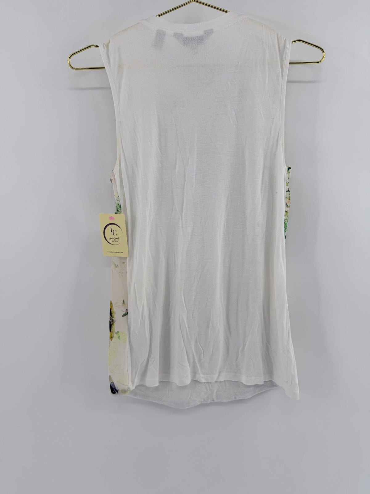 Lynn's Closet Boutique Ted Baker sleeveless top featuring a solid white knit back and floral print side panels.