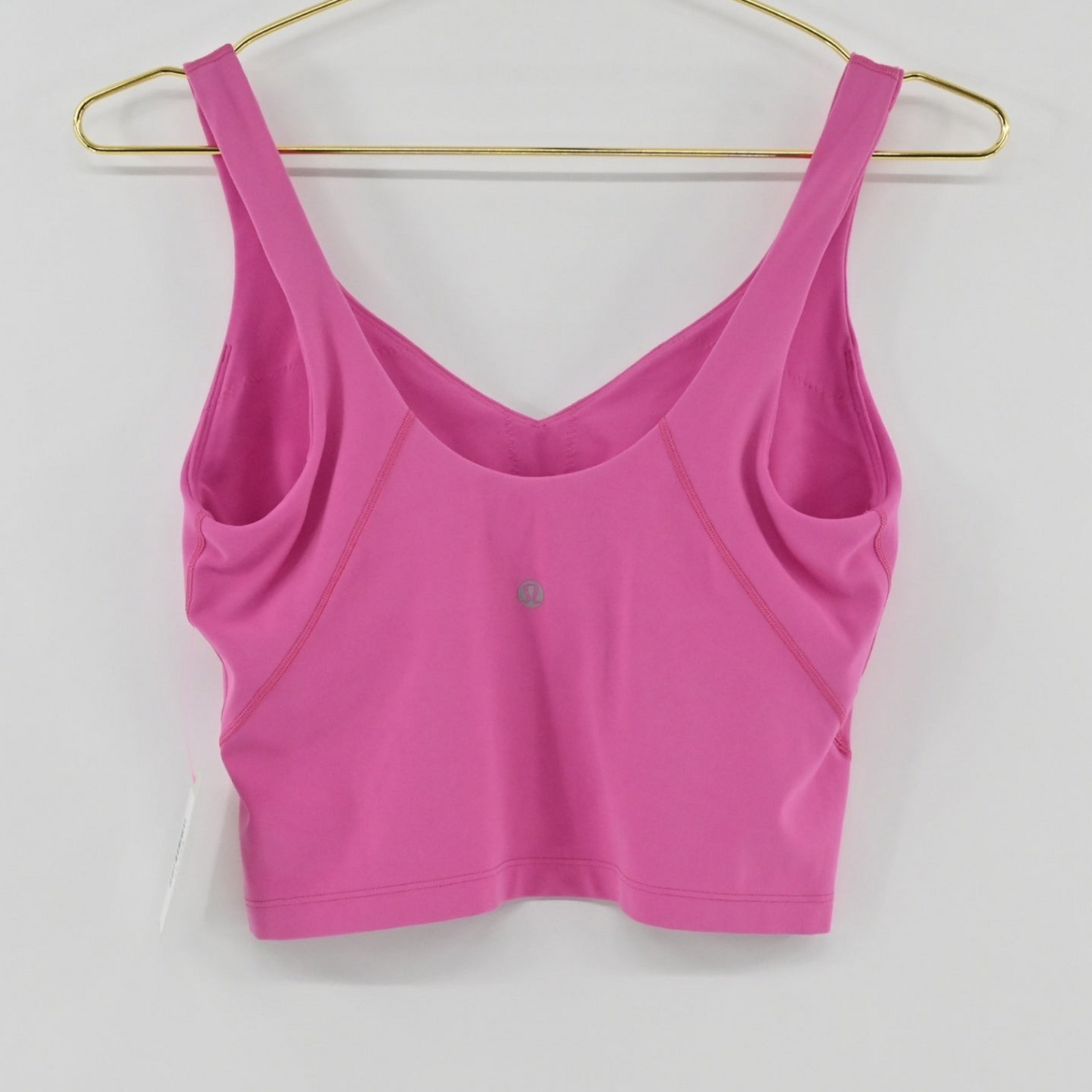 Lynn's Closet Boutique pink Lululemon Align tank top with V-neckline and cropped silhouette on a gold hanger