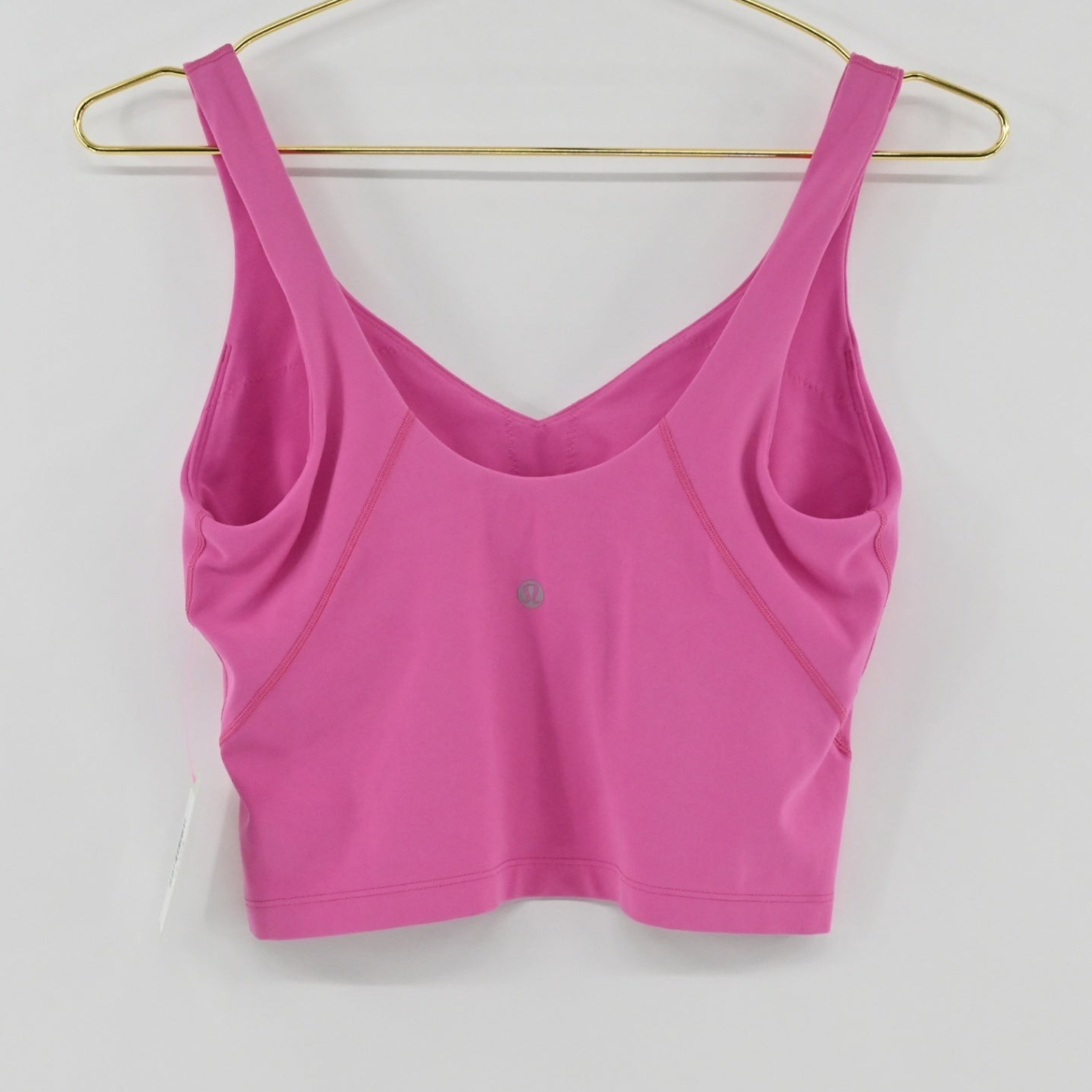 Lynn's Closet Boutique pink Lululemon Align tank top with V-neckline and cropped silhouette on a gold hanger