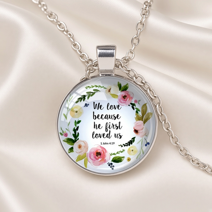 Bible Verse Glass Cabochon Pendant Necklace Floral Wreath Silver Tone - 1 John 4:19 close-up
