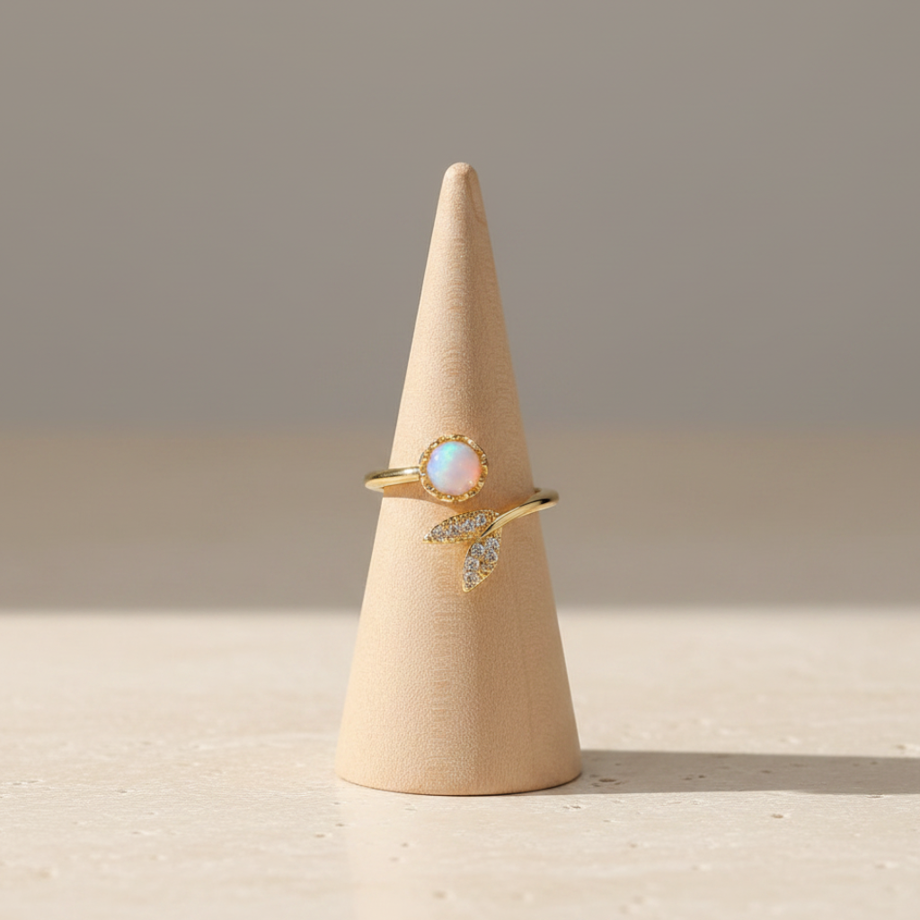 Lynn's Closet Boutique gold plated adjustable ring featuring an artificial opal stone and rhinestone leaf detail.