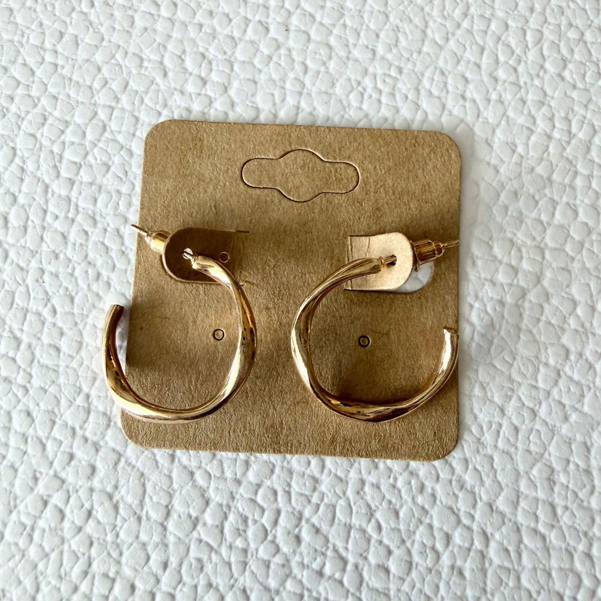 Gold thin wavy hoop earrings