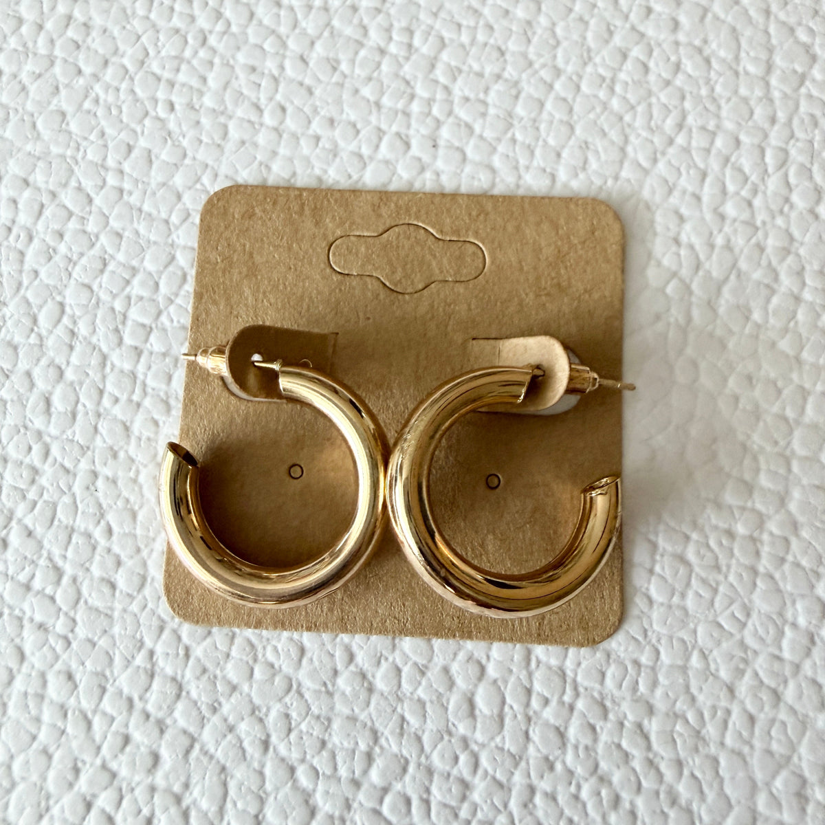 Gold wide wavy hoop earrings