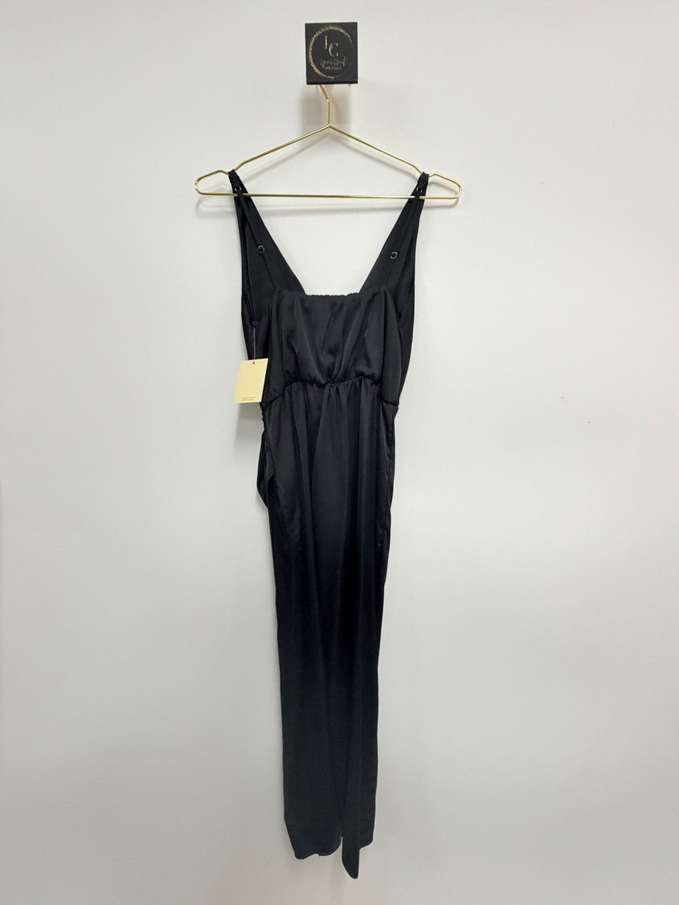 Lynn's Closet Boutique Abercrombie & Fitch black satin maxi dress with V-neck and ruched side detail on a hanger.