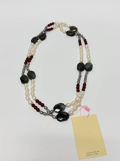 Lynn's Closet Boutique multi-strand necklace with white pearls, red carnelian, and faceted dark agate beads.