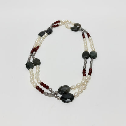 Lynn's Closet Boutique multi-strand necklace with freshwater pearls, red carnelian, and faceted dark agate beads.