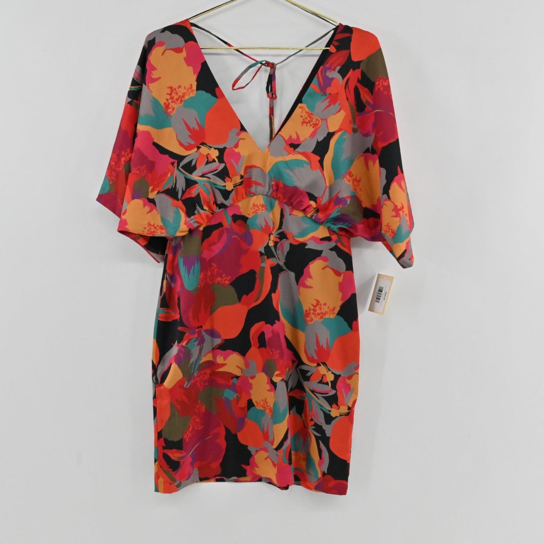 Lynn's Closet Boutique Aidan Mattox satin mini dress featuring a vibrant floral print, V-neck, and kimono sleeves.