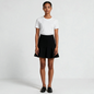 Model wearing a Lynn's Closet Boutique black Akris Punto skater skirt with a flared godet hem and white t-shirt