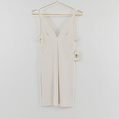 Lynn's Closet Boutique Amanda Uprichard white mini dress with deep V-neck and cold-shoulder detail on a gold hanger.