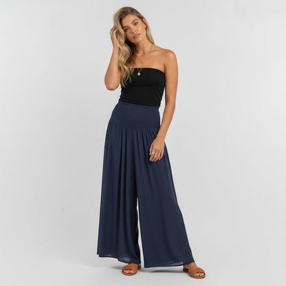 Lynn's Closet Boutique Amati blue silk wide-leg pants with smocked waist and flowy silhouette, size M.
