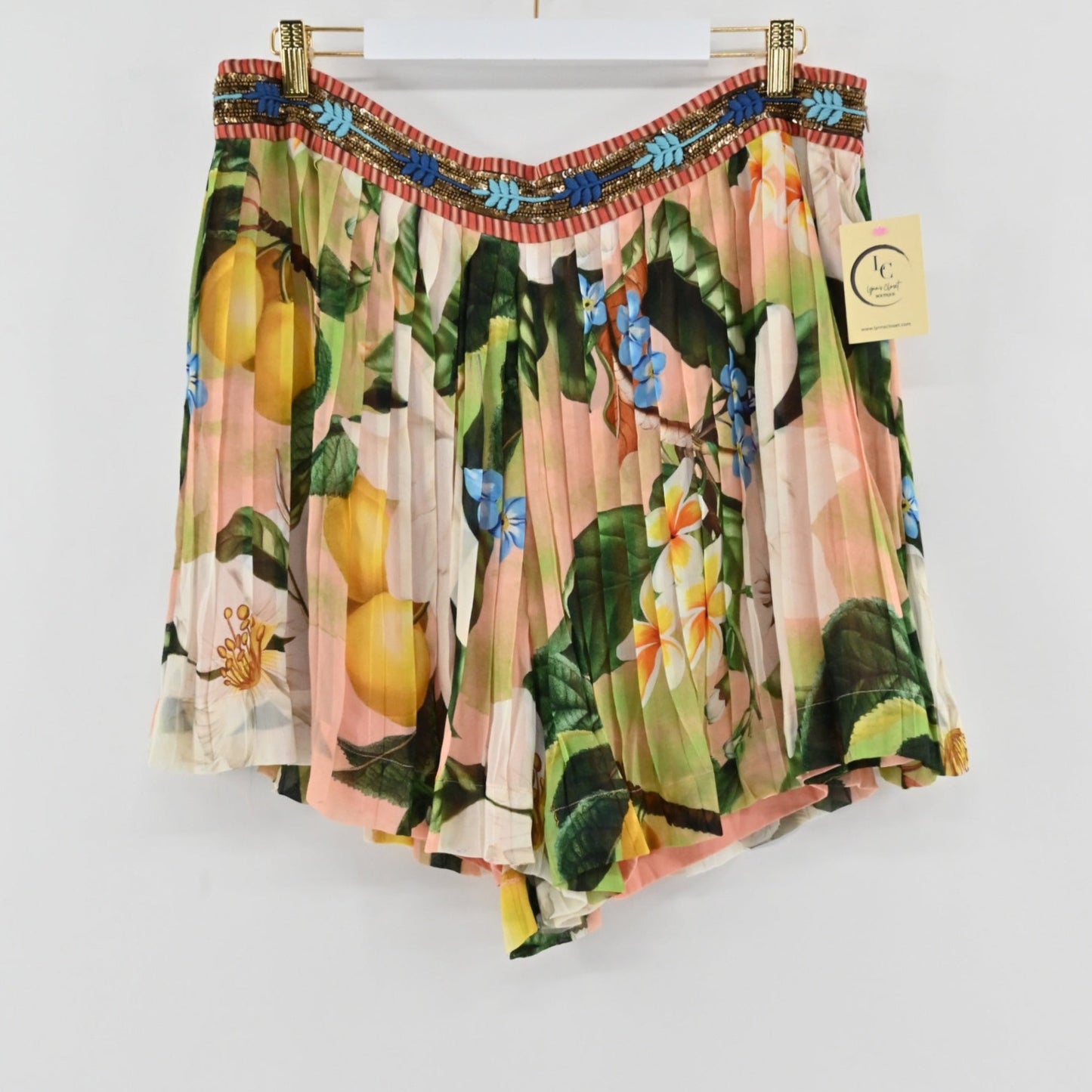 Lynn's Closet Boutique Anthropologie Verb Melody pleated shorts with a floral citrus print and beaded waistband.