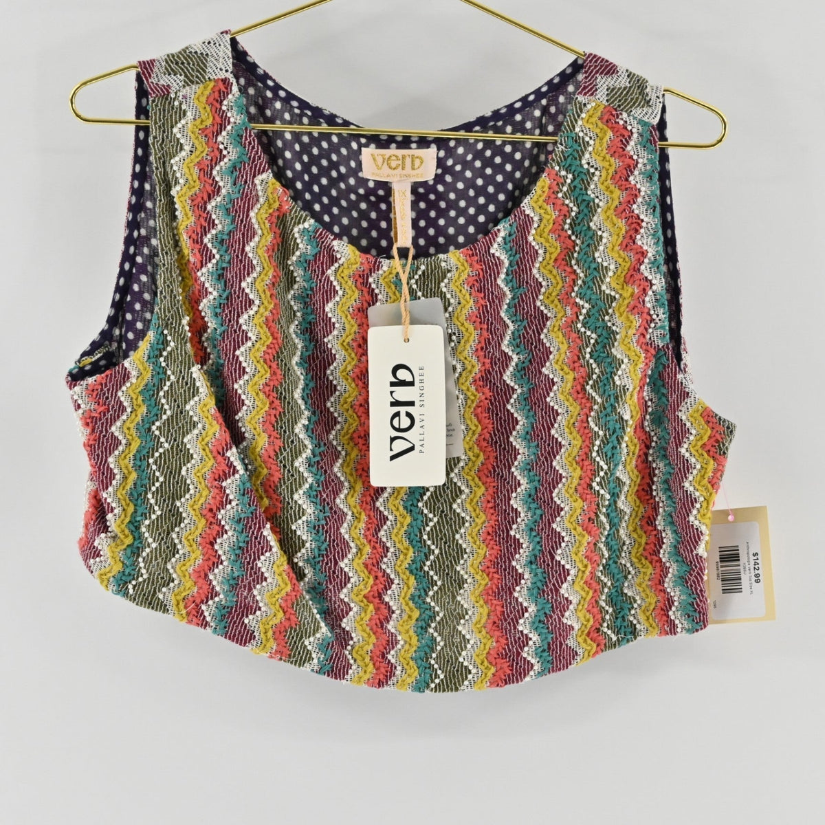 Lynn's Closet Boutique Anthropologie Verb sleeveless cropped top with a multi-colored chevron pattern and polka dot lining