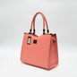 Badgley Mischka coral vegan leather tote bag with braided handles and logo hardware from Lynn's Closet Boutique.