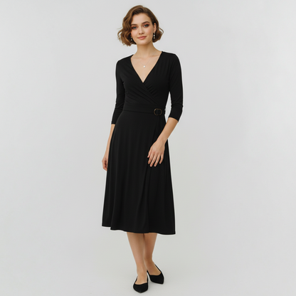 Model wearing a black BCBGMaxAzria wrap dress with three-quarter sleeves and a buckle waist from Lynn's Closet Boutique