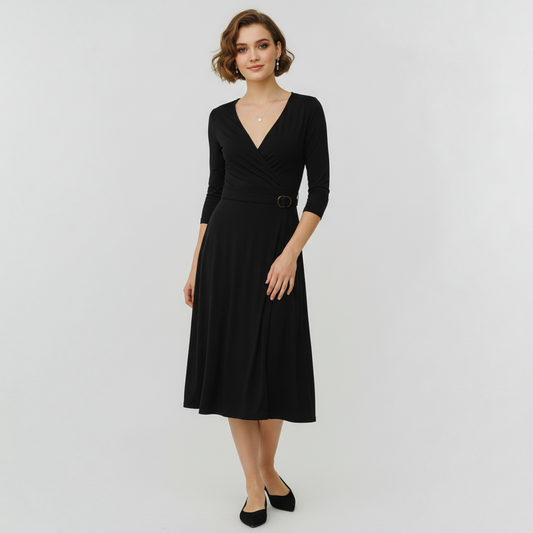 Model wearing a black BCBGMaxAzria wrap dress with three-quarter sleeves and a buckle waist from Lynn's Closet Boutique