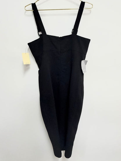 Lynn's Closet Boutique black bodycon midi dress with a square neckline and wide straps hanging on a gold hanger.