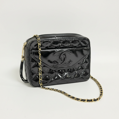 Lynn's Closet Boutique black quilted patent leather Chanel camera bag with gold chain strap and CC logo