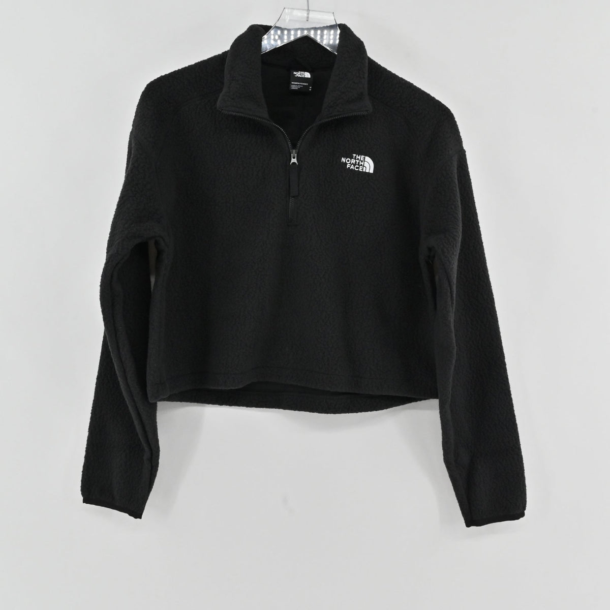 Lynn's Closet Boutique black The North Face cropped quarter-zip fleece with stand-up collar and white chest logo