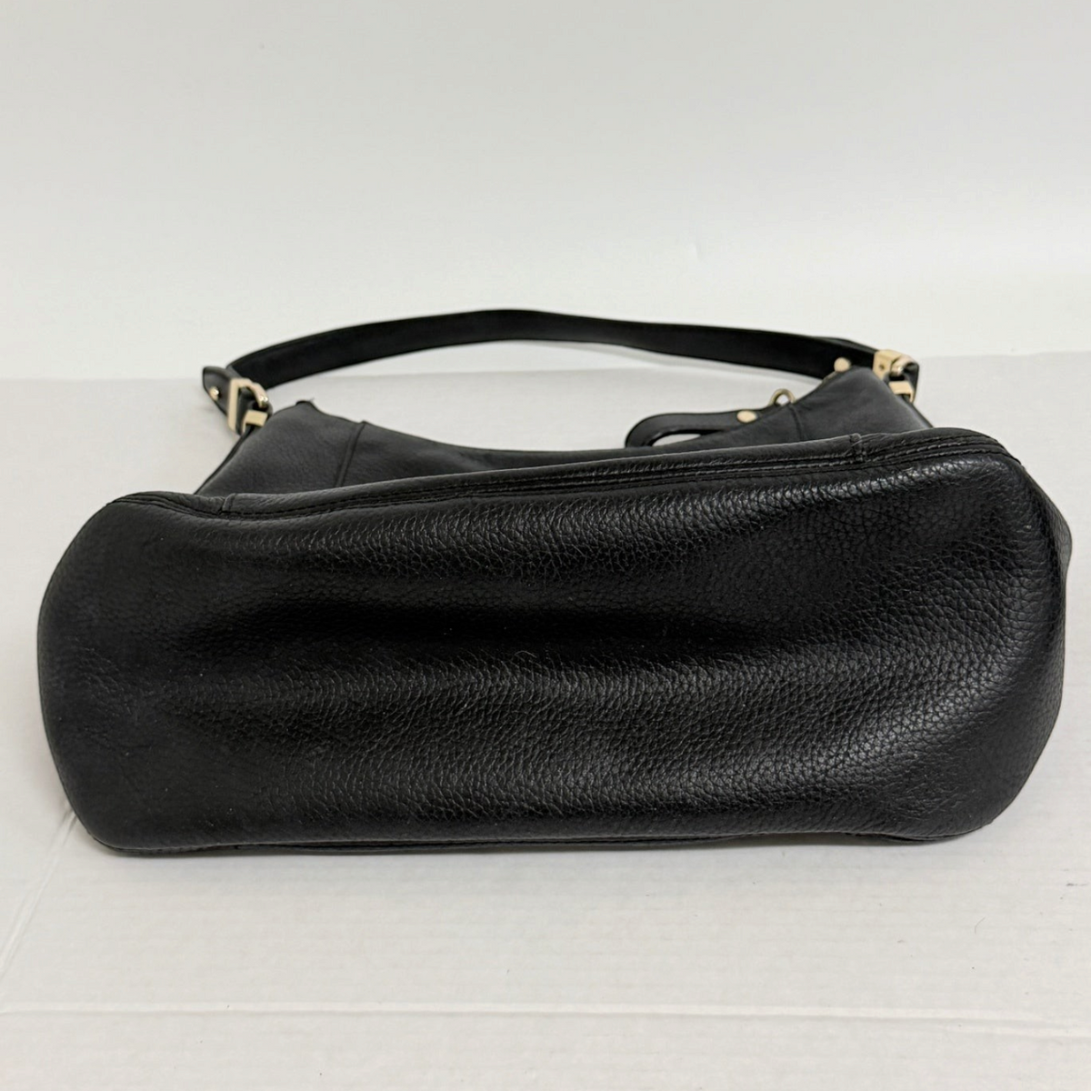 Lynn's Closet Boutique black pebbled leather Michael Kors tote bag showing the base and shoulder strap
