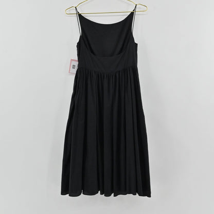 Lynn's Closet Boutique black midi dress with spaghetti straps and a gathered waist, shown hanging on a gold hanger.